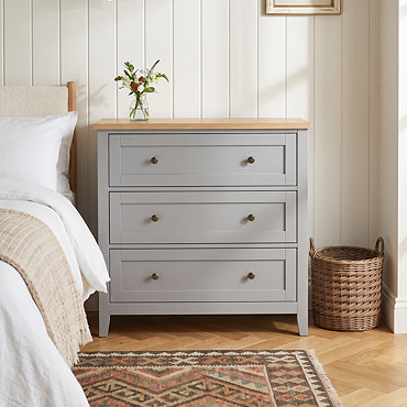 close up image of three drawer chest in grey
