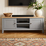 close up on two doors and shelf of painted grey tv unit