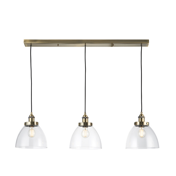 image cut out on white background of three-drop antique brass lights