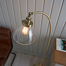 image taken above over antique brass floor lamp with clear shade