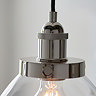close up on nickel fixture of pendant ceiling light where clear glass shade meets nickel top