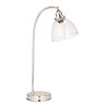 image cut out on white background of gently arched nickel table lamp