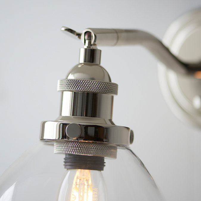 close up image of nickel fixture of wall light