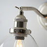 close up image of nickel fixture of wall light