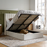 image of white ottoman bed with the mattress lifted up to reveal the storage compartment underneath