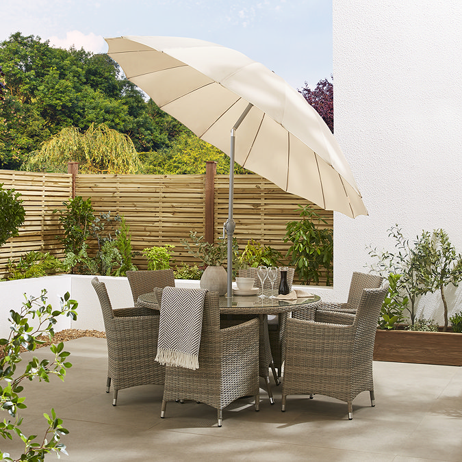 image of ecru parasol in light brown table, shade tilted to show adjustable top