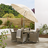 image of ecru parasol in light brown table, shade tilted to show adjustable top