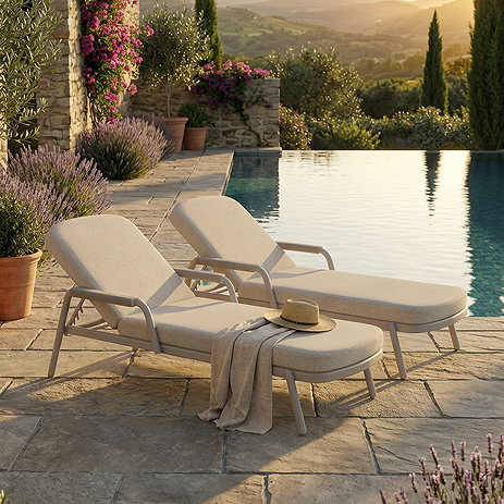image of light coloured haze loungers with aluminium frames on patio