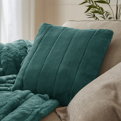 Green Heaton Cushion Front View on Cream Chair