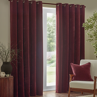 Heavy chenille eyelet curtains in beetroot on window image 1