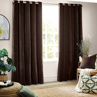 close up on top of chocolate brown curtains, highlighting eyelet design