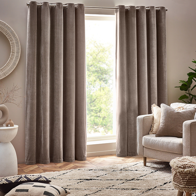 Heavy chenille greige eyelet curtain on window image 1