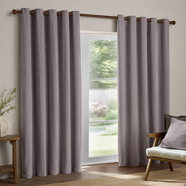 Heavy Chenille Mauve Eyelet curtains over a window close up image