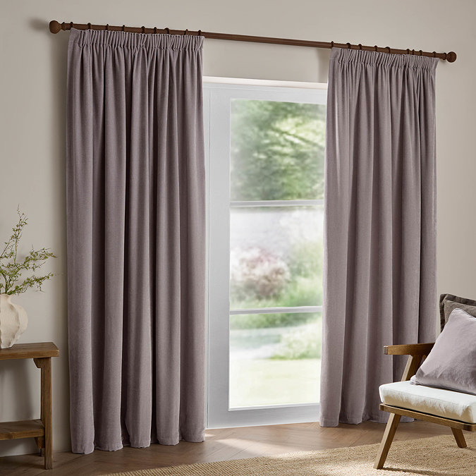 Heavy Chenille Mauve pencil pleat curtains over a window image