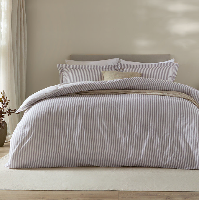 Hebden Duvet cover in mauve on bed image 1