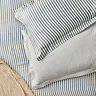 Hebden navy pillowcase pair on bed image 1
