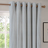 Hebden Striped Blackout Eyelet Curtains in mineral blue over a window image