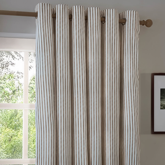 Hebden Striped Blackout Eyelet Curtains in Mole over a window image