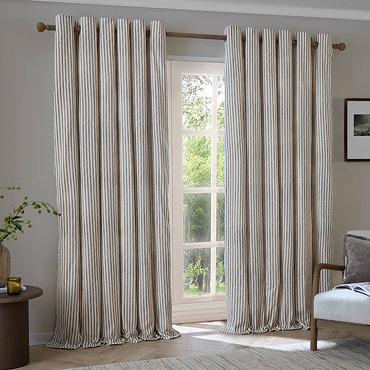 Hebden Striped Blackout Eyelet Curtains in Mole over a window image