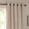 close up on eyelet style striped natural coloured curtains
