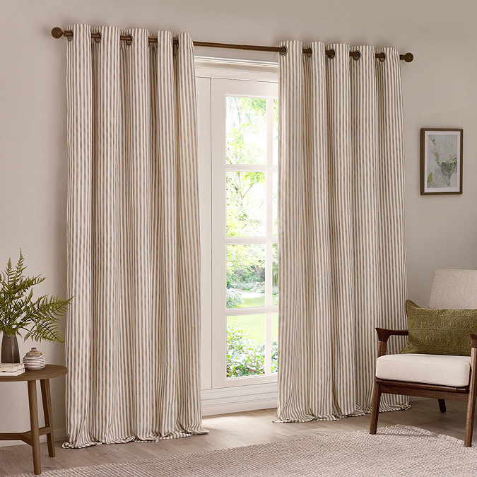 natural coloured stripe curtains open across a large living room window
