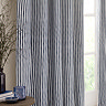 close up on navy blue striped left curtain