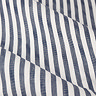 close up on pattern and texture of navy blue striped curtain