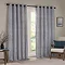 navy blue striped curtains open over a large living room window