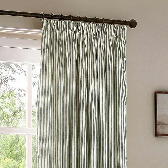 close up image of pencil pleat style green striped curtains