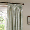 close up image of pencil pleat style green striped curtains