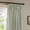 close up image of pencil pleat style green striped curtains