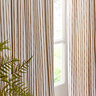 close up on middle section of natural coloured curtains, showcasing their elegant drape and striped design