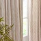 close up on middle section of natural coloured curtains, showcasing their elegant drape and striped design