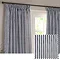 image of navy blue striped curtain open across living room window, with cut out of curtain pattern and texture in a square in the right side