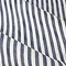 close up on pattern and texture of navy blue striped curtain