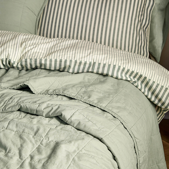 washed cotton bay green bedspread on bed image