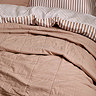 washed cotton bedspread on bed image
