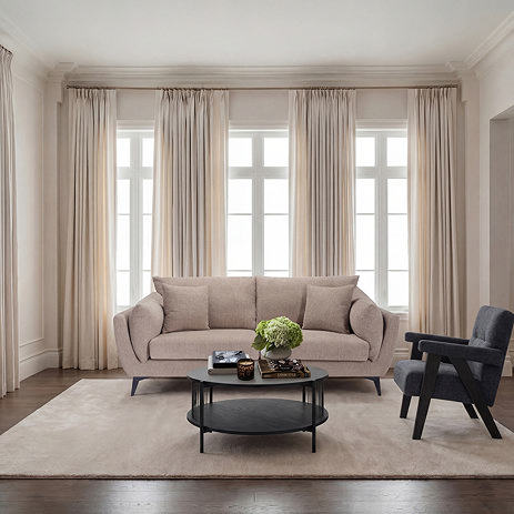 image of taupe chenille 3 seater sofa in living room in front of window