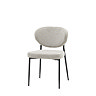image cut out on white background of upholstered dining chair with black metal legs