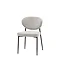 image cut out on white background of upholstered dining chair with black metal legs