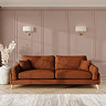 lifestyle image of grand sofa with light oak feet in mandarin fabric