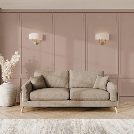 lifestyle image of large sofa with light oak feet in latte fabric