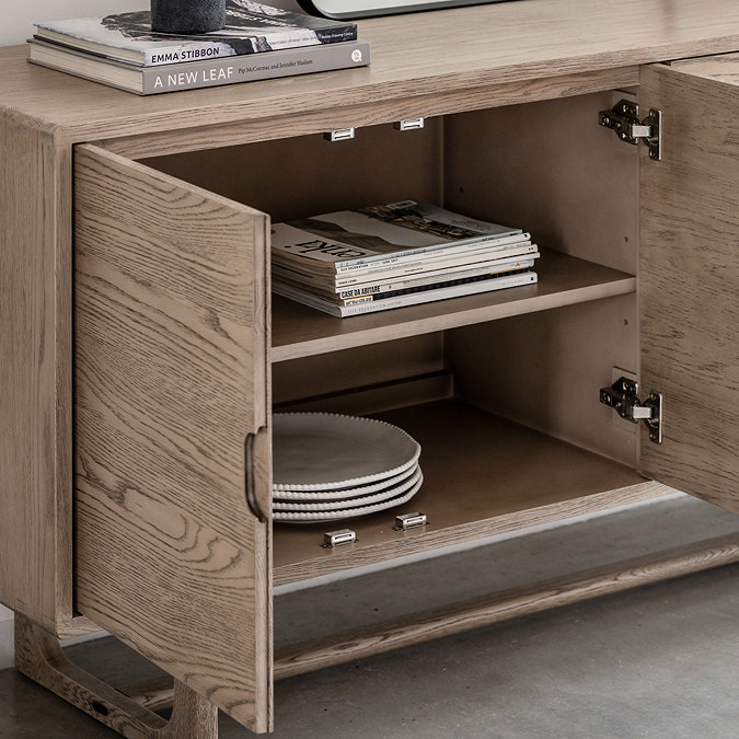image of sideboard doors open to show shelf space within