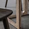 close up on legs of smoked oak dining table