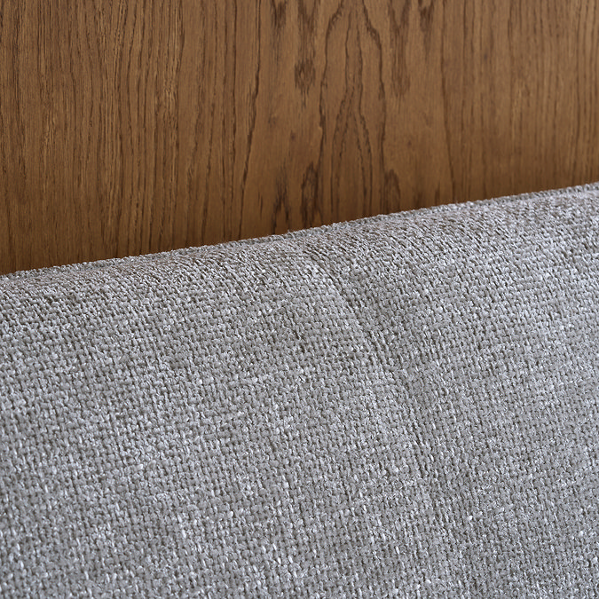 close up on fabric material of grey headboard