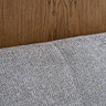 close up on fabric material of grey headboard