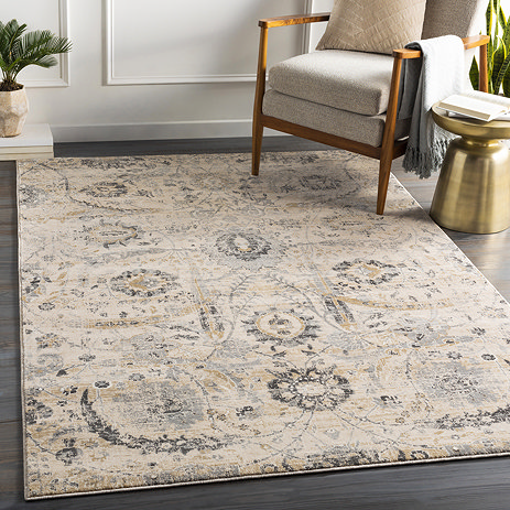 image of beige rug patterned with mustard and grey floral designs