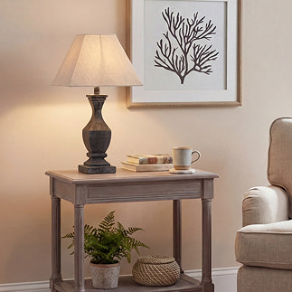 image of tall fluted washed brown table lamp on console table in living room