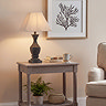 image of tall fluted washed brown table lamp on console table in living room