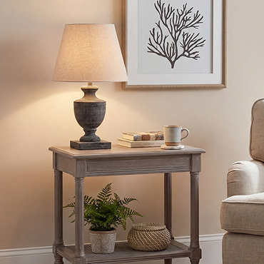 cut out image of brown urn shaped table lamp with linen shade